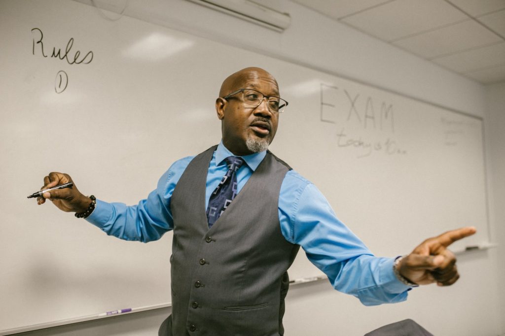 teacher giving out instructions